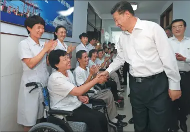  ?? LAN HONGGUANG / XINHUA ?? President Xi Jinping visits survivors of the 1976 Tangshan earthquake at a nursing home in Tangshan, Hebei province, on Thursday. The magnitude-7.8 earthquake killed more than 240,000 people.