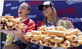  ?? Photograph: Julia Nikhinson/AP ?? Joey Chestnut and Miki Sudo pose with 63 and 40 hot dogs, respective­ly, after winning the Nathan's Famous Fourth of July hot dog eating contest in Coney Island on Monday.