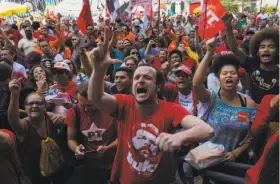  ?? Lalo De Almeida / New York Times ?? Supporters of former President Luiz Inacio Lula da Silva rally outside the headquarte­rs of the metal workers union in São Bernardo do Campo, Brazil.