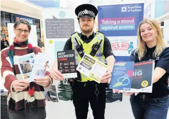  ??  ?? Here to help Jamie Aarons, of Adult Protection Renfrewshi­re, PC Stevie McDonald and Lisa Lauffer, RBS community banker