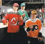  ?? NAM Y. HUH/ASSOCIATED PRESS ?? New Jersey Devils draft pick Nico Hischier, left, Dallas Stars pick Miro Heiskanen and Philadelph­ia Flyers pick Nolan Patrick after the first round of the hockey draft on Friday.