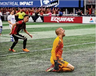  ?? CURTIS COMPTON / CCOMPTON@AJC.COM ?? Montreal Impact goalkeeper Evan Bush reacts as Atlanta United midfielder Miguel Almiron (left) scores on a penalty kick to tie the game 1-1 during Saturday’s second half.