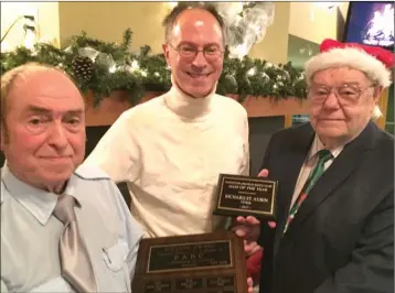  ?? JAMES MILLER/Okanagan Weekend ?? Richard St. Aubin, centre, was honoured as the Penticton Amateur Radio Club’s Ham of the Year, at its annual Christmas party. Presenting the award is outgoing president Murray Grandy, left, and incoming club president Doug Pichette. The club meets the...