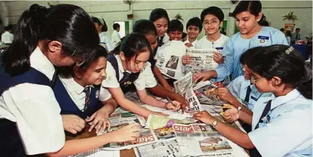  ??  ?? Pupils putting their English language proficienc­y to the test during a Newspaper In Education (NiE) activity. - File photo