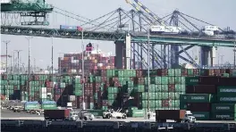  ?? JAE C. HONG AP ?? Shipping containers are stacked at the Port of Los Angeles earlier this month. Wednesday, the Biden administra­tion promised a ‘90-day sprint’ to clear cargo from the docks.