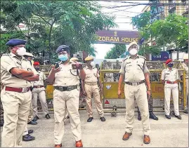  ??  ?? Assam security personnel stand vigil outside the Mizoram House in Guwahati on July 29.