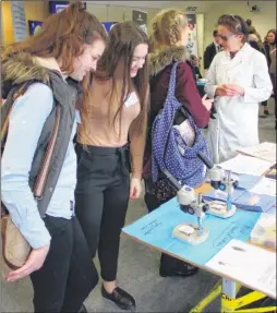  ??  ?? Students take a look at one of the stalls during a careers open day at Maidstone Hospital