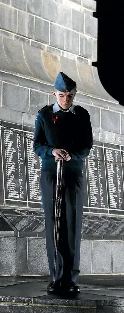  ?? PHOTO: BRITTANY PICKETT/FAIRFAX NZ 632336839 PHOTO: ROBYN EDIE/FAIRFAX NZ 632336279 ?? Air Training Corps cadet Mackenzie Fallow, 14, stands solemn guard at the Cenotaph during yesterday’s Anzac Day dawn service in Invercargi­ll.