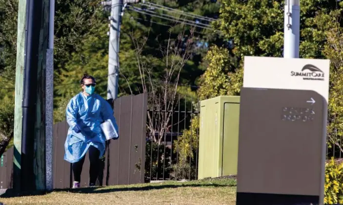  ?? Getty Images ?? A person in PPE arrives at SummitCare aged care facility in Sydney’s Baulkham Hills on Sunday after it was revealed three residents had tested positive to Covid-19. Two staff members were infected last week. Photograph: Jenny Evans/