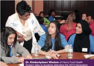  ??  ?? Dr. Kimberlyda­wn Wisdom of Henry Ford Health System talks to students attending the 2013 Generation With Promise Youth Summit, which was sponsored by the system.