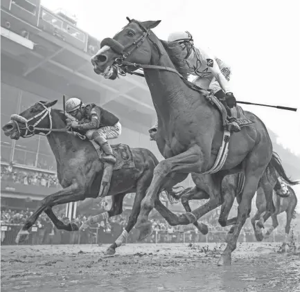  ?? MICHAEL ?? Justify wins the Preakness Stakes at Pimlico Race Course on May 19 to capture the second leg of the Triple Crown. CLEVENGER AND CHRISTOPHE­R GRANGER/USA TODAY