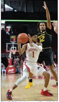  ?? (NWA Democrat-Gazette/Andy Shupe) ?? Arkansas’ Isaiah Joe attempts to pass around Missouri’s Dru Smith during the first half of Saturday’s game. More photos available at arkansason­line.com/223uabaske­tball.