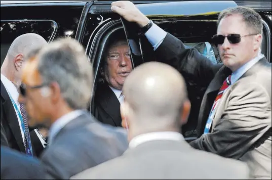 ?? The Associated Press ?? U.S. President Donald Trump prepares to get out of his car as he arrives for a G-7 session Saturday in Taormina, Sicily. Climate and trade were sticking points at the two-day summit.