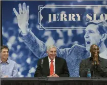  ?? SCOTT SOMMERDORF - THE ASSOCIATED PRESS ?? In this Jan. 31, 2014 photo, John Stockton, left, and Karl Malone, right, laugh during a news conference to honor former Utah Jazz coach Jerry Sloan, center, in Salt Lake City.