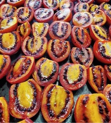  ??  ?? LEFT Tamarillos, or tree tomatoes, are grilled before they’re cooked to make a lovely sweet chilli chutney. BELOW Home-fermented kombucha with naartjie rind and cinnamon. BELOW LEFT Cannelés, custardy confection­s traditiona­lly from Bordeaux, France, are a favourite dessert in the Mouton house.