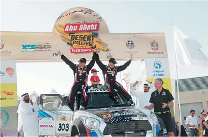  ?? Supplied photo ?? Russian Vladimir Vasilyev and co-driver Konstantin Zhilstov celebrate their cars victory in the Abu Dhabi Desert Challenge with ATCUAE President Mohammed Ben Sulayem and team manager Sven Quandt at the finish at the Yas Marina Circuit. —