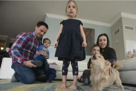  ?? RICK MADONIK/TORONTO STAR ?? Child-care moves were good news for Andy Guglielmi and his wife, Mimi Rego, twins Lennon (with mom) and Beckham (with dad), and 5-year-old Logan.