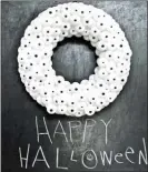  ?? The Associated Press ?? HGTV managing editor Camille Smith recommends this googly-eyed wreath as a fun one for kids: Cover a white foam wreath with pingpong balls garnished with small and large googly eyes. “If you store it flat (so the balls don’t dent), it never goes bad,”...