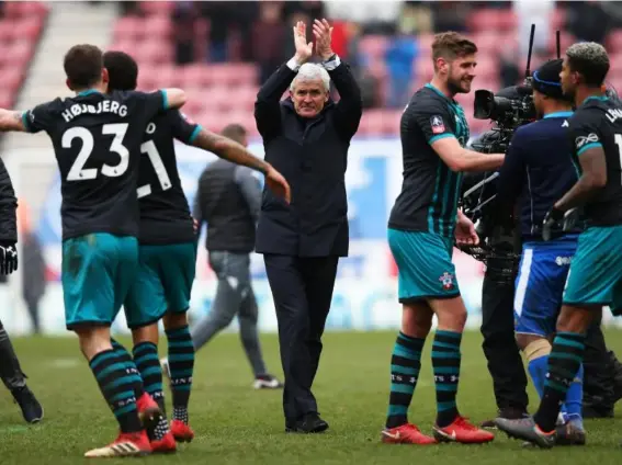  ??  ?? Mark Hughes applauds the Southampto­n supporters (Getty Images)