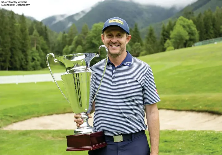  ??  ?? Stuart Manley with the Euram Bank Open trophy