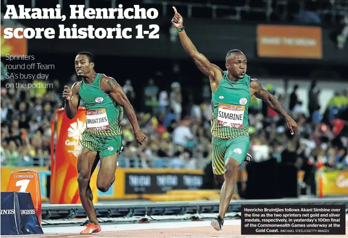  ?? /MICHAEL STEELE/GETTY IMAGES ?? Henricho Bruintjies follows Akani Simbine over the line as the two sprinters net gold and silver medals, respective­ly, in yesterday’s 100m final of the Commonweal­th Games underway at the Gold Coast.