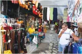  ?? Reuters ?? Shopkeeper­s wait for customers in front of a souvenir shop following Thomas Cook’s collapse, in Hammamet, Tunisia.