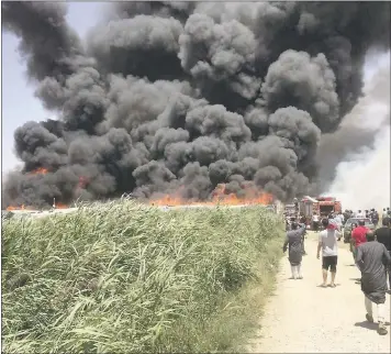  ?? QAB ELIAS EMERGENCY SERVICES VIA THE ASSOCIATED PRESS ?? Smoke billows from a Syrian refugee camp in the Bekaa Valley. Lebanon’s state news agency said it was a major fire.