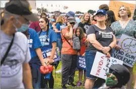  ?? Kent Nishimura Los Angeles Times ?? GUN CONTROL supporters take part in the March for Our Lives rally in Washington on Saturday. Anti-gun groups praised senators’ deal on new restrictio­ns.