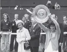  ??  ?? 0 Virginia Wade celebrates taking the women’s singles tennis championsh­ip at Wimbledon on this day in 1977