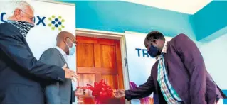  ?? ?? King Cetshwayo District Mayor, AT Ntuli, cutting the ribbon to Gubhethuka Primary School’s new administra­tion block. He is accompanie­d by Cllr Stan Larkan to the far left and Mpho Mothoa, second from left