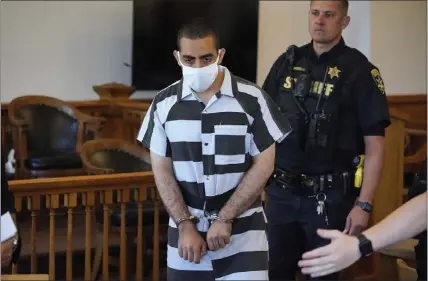  ?? GENE J. PUSKAR — THE ASSOCIATED PRESS ?? Hadi Matar, 24, center, arrives for an arraignmen­t in the Chautauqua County Courthouse in Mayville, New York, on Saturday. Matar, who is accused of carrying out a stabbing attack against author Salman Rushdie, gave a not-guilty plea.