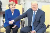  ?? EVAN VUCCI — THE ASSOCIATED PRESS ?? President Donald Trump meets with German Chancellor Angela Merkel in the Oval Office of the White House.