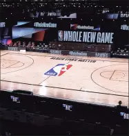  ?? Kevin C. Cox / Getty Images ?? An empty court and bench is shown following the scheduled start time for a game between the Milwaukee Bucks and Orlando Magic on Aug. 26. The teams boycotted the game to protest the shooting of Jacob Blake in Kenosha, Wisconsin.