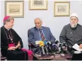  ?? EPA ?? The Catholic Archbishop of Sydney, Anthony Fisher, left, and the Grand Mufti, Dr Ibrahim Abu Mohammad, centre.