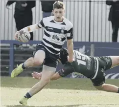  ??  ?? 0 Alex Ball evades a tackle to spark a Heriot’s attack on Saturday.