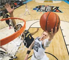  ?? Chris Steppig / Associated Press ?? Villanova’s Donte DiVincenzo goes up for a shot past Michigan’s Charles Matthews in April’s NCAA title game.