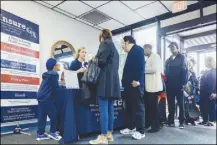  ?? AUDRA MELTON / THE NEW YORK TIMES ?? Amber Higgins, a navigator with Insure Georgia, provides informatio­n about enrolling for health insurance through the Affordable Care Act during a child safety expo Oct. 28 in Macon, Ga. As the ACA’s fifth open enrollment period starts, the law is...