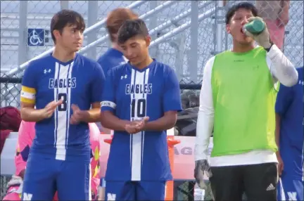  ?? ED MORLOCK — MEDIANEWS GROUP ?? Norristown’s Renato Castillo, left, Diego Guzman, center, and Jimmy Moreno look on before Wednesday night’s game against Reading.