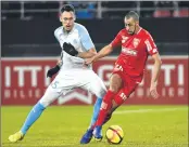  ??  ?? Olympique de Marseille's Argentinia­n forward Lucas Ocampos (L) vies with Dijon's French defender Fouad Chafik (R) during the French League on Friday