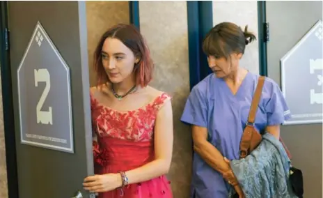  ?? MERIE WALLACE/A24 VIA THE ASSOCIATED PRESS ?? Saoirse Ronan, left, who plays Laurie Metcalf’s daughter in speaks highly of her co-star’s commitment to her work as an actor.