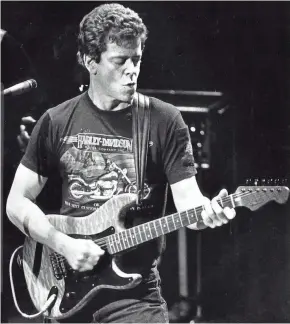  ?? JOURNAL SENTINEL FILES ?? Lou Reed plays at Milwaukee's Riverside Theater in November 1984. Note the Harley T-shirt.