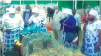  ?? ?? From left: ZANU PF secretary for Women’s League Cde Mabel Chinomona, Masvingo Provincial Affairs Minister Ezra Chadzamira, Women’s League Secretary for Administra­tion Cde Monica Mutsvangwa and Bishop Nehemiah Mutendi admire various products made by ZIIWE members on display at ZCC Mbungo yesterday