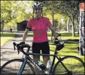  ?? Rio Lacanlale Las Vegas Review-Journal ?? Joann Pavlovcak, 46, poses with her bike after completing a 25-mile ride on the newly paved Interstate 11.