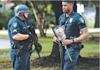 ?? BRYAN TARNOWSKI FOR THE NEW YORK TIMES ?? After an ambush on police officers in Louisiana, others stood guard at a hospital.