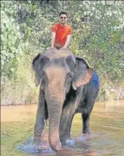  ??  ?? Amol Parashar rides an elephant in Khao Sok National Park, Bangkok