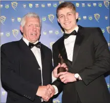  ?? Killian Spillane accepting the Munster GAA Under 21 Footballer of the Year award from Munster GAA Chairman Jerry O’Sullivan ??