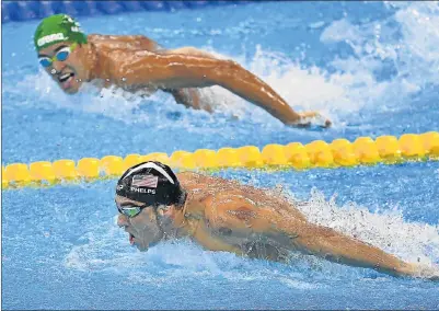  ?? Picture: GETTY IMAGES ?? SWEET REVENGE: Michael Phelps, left, of the United States leads Chad le Clos of South Africa in the 200m butterfly final