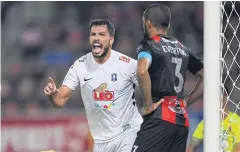  ??  ?? Pathum United’s Victor Cardozo celebrates after scoring against Bangkok United.