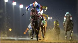  ?? MARTIN DOKOUPIL – THE ASSOCIATED PRESS ?? Panthalass­a, a 15-1 long shot with jockey Yutaka Yoshida aboard, wins the $20 million Saudi Cup on Saturday at the King Abdulaziz racetrack in Riyadh, Saudi Arabia.