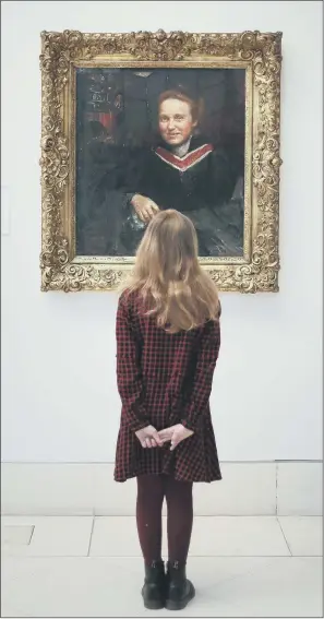  ?? PICTURE: PHILIP TOSCANO/PA ?? HISTORIC PAINTING: Stella Cartwright, aged nine, looks at Annie Swynnerton’s portrait of suffragist Millicent Fawcett, as it goes on display at Tate Britain